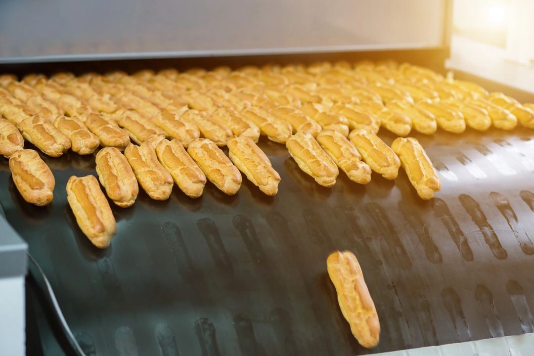 Pastries coming out of a machine